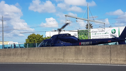 A helicopter has just landed on Auckland's Motorway!