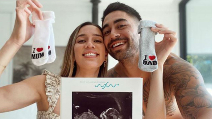 Kayla Johnson debuts her baby bump